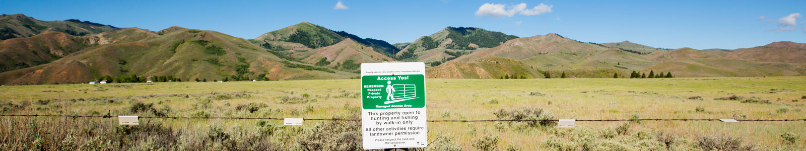 AccessYes! signage on property fence. Photo by Glenn Oakley