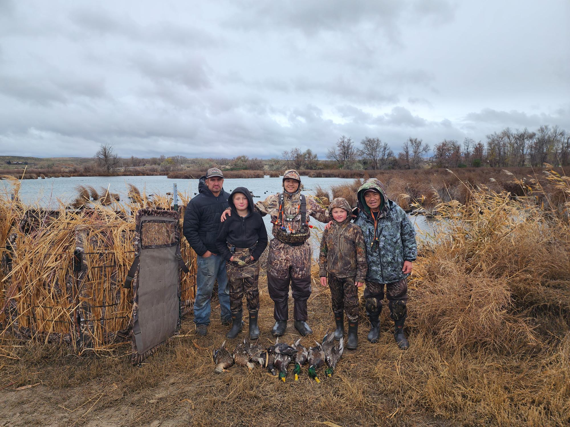 Mentors with their youth hunters after their waterfowl hunt at the Hagerman WMA.